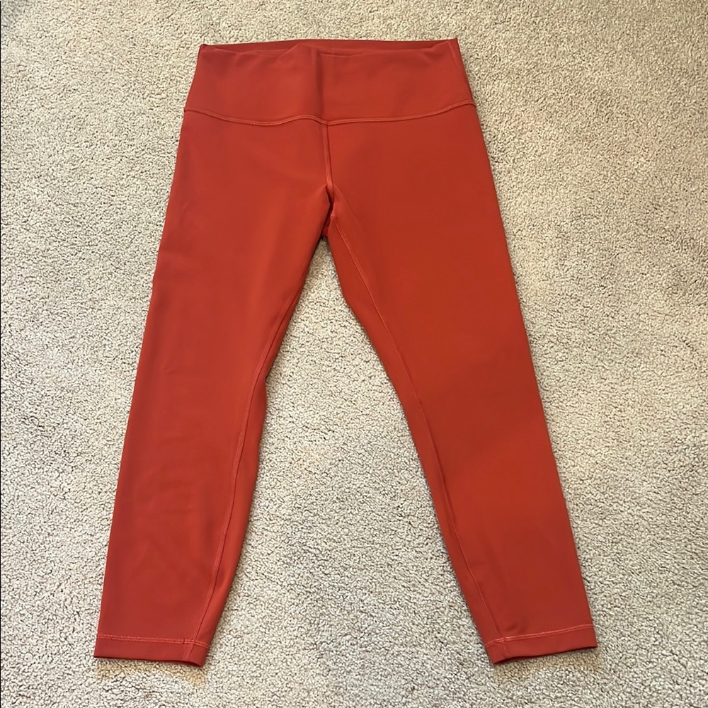 Lululemon orange leggings, size 12